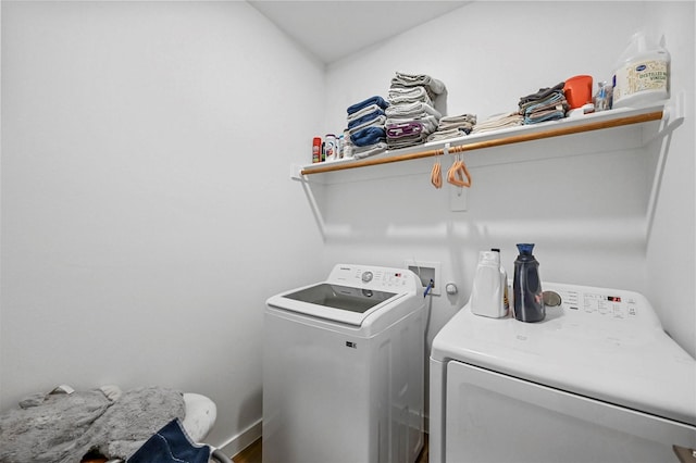 clothes washing area featuring washer and dryer