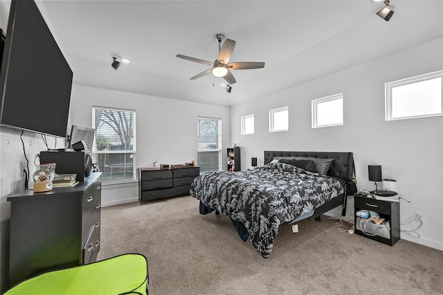 carpeted bedroom with ceiling fan