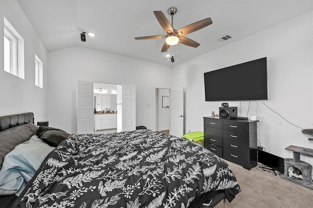 bedroom with carpet, lofted ceiling, ceiling fan, and ensuite bath