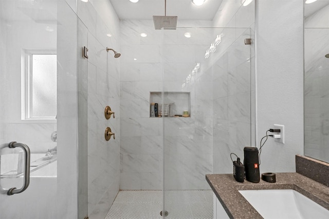 bathroom featuring vanity and walk in shower