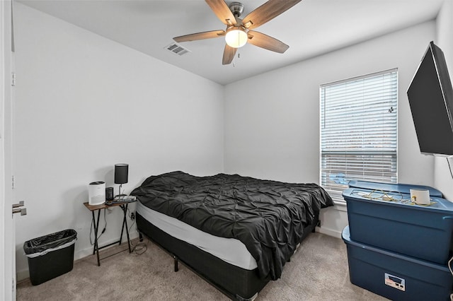 carpeted bedroom featuring ceiling fan