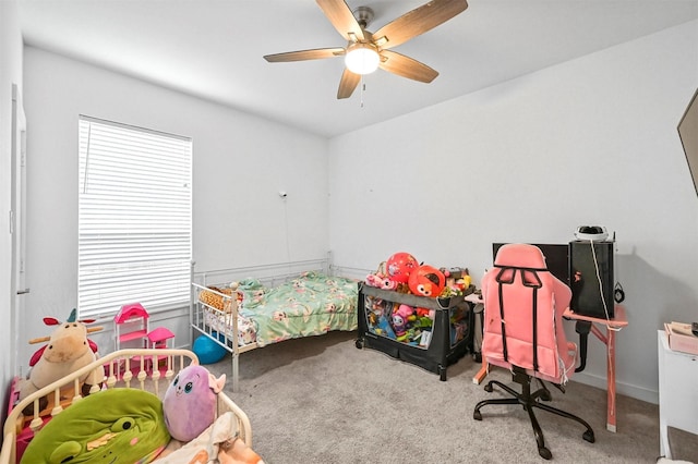 bedroom with ceiling fan, multiple windows, and carpet