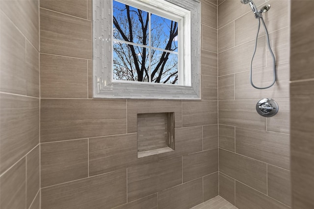 bathroom with a tile shower