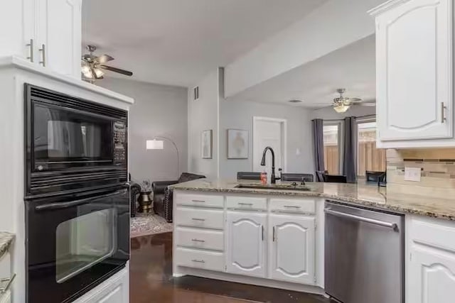 kitchen with white cabinetry, sink, black appliances, and kitchen peninsula