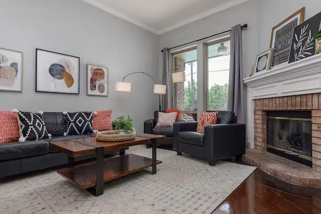 living room with a brick fireplace and crown molding