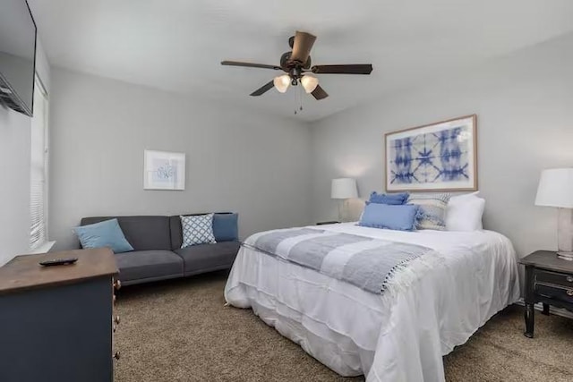 bedroom featuring dark carpet and ceiling fan