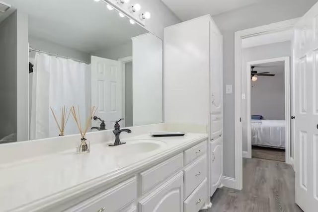 bathroom featuring vanity and hardwood / wood-style flooring