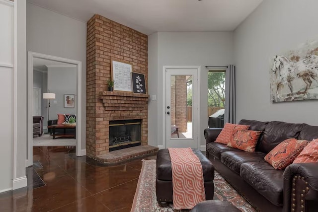 living room with dark tile patterned floors and a fireplace