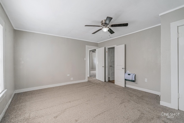 unfurnished bedroom featuring crown molding, carpet flooring, and ceiling fan