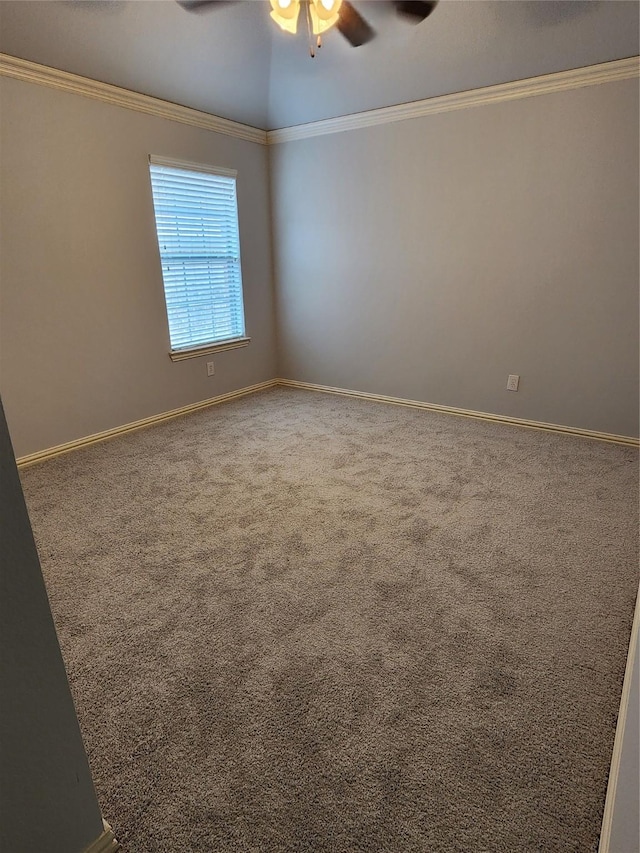 carpeted empty room featuring crown molding and ceiling fan