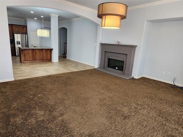 unfurnished living room with ornamental molding and light carpet