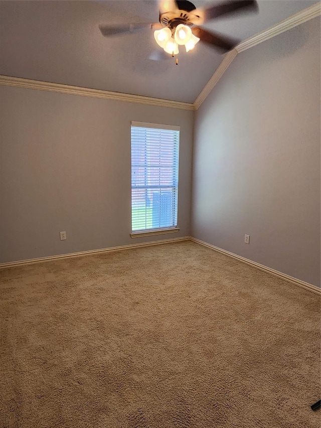 empty room with crown molding, lofted ceiling, carpet flooring, and ceiling fan