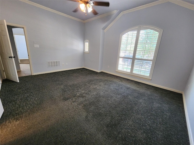 carpeted empty room with ceiling fan, ornamental molding, and vaulted ceiling