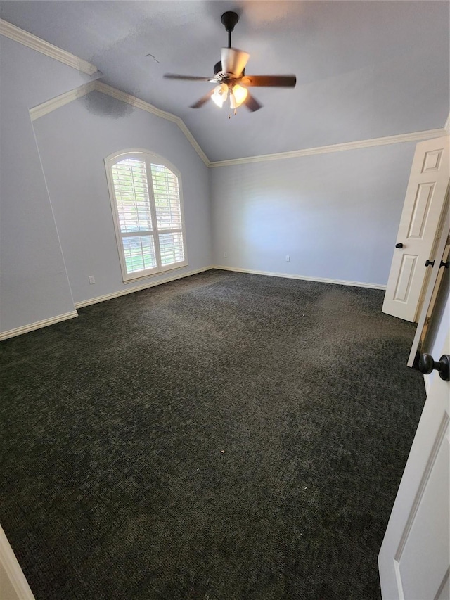 unfurnished room with dark colored carpet, lofted ceiling, ceiling fan, and crown molding