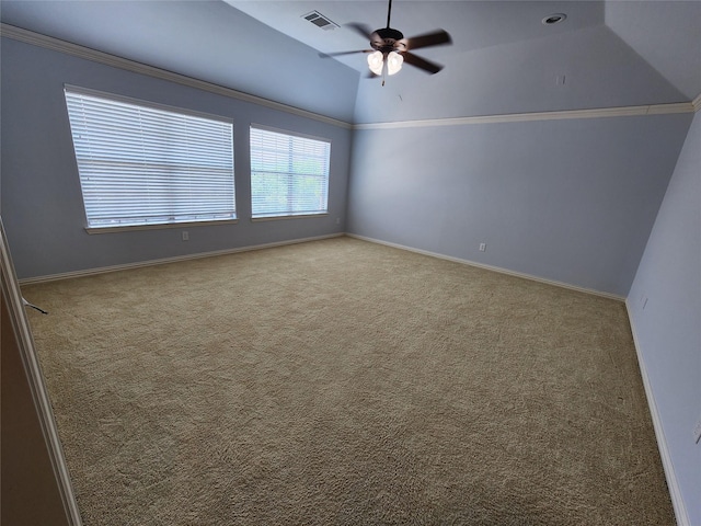 empty room with lofted ceiling, light colored carpet, and ceiling fan