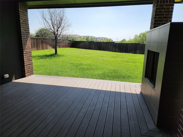 wooden terrace with a yard