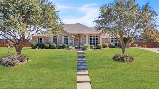 single story home with a front yard