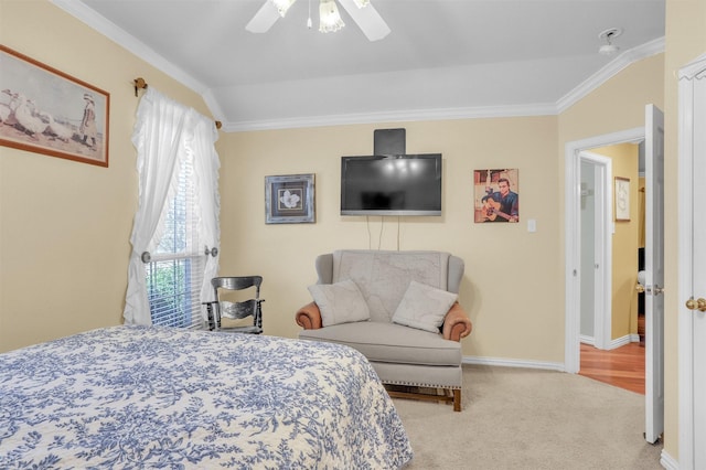 bedroom with ornamental molding, light colored carpet, and ceiling fan