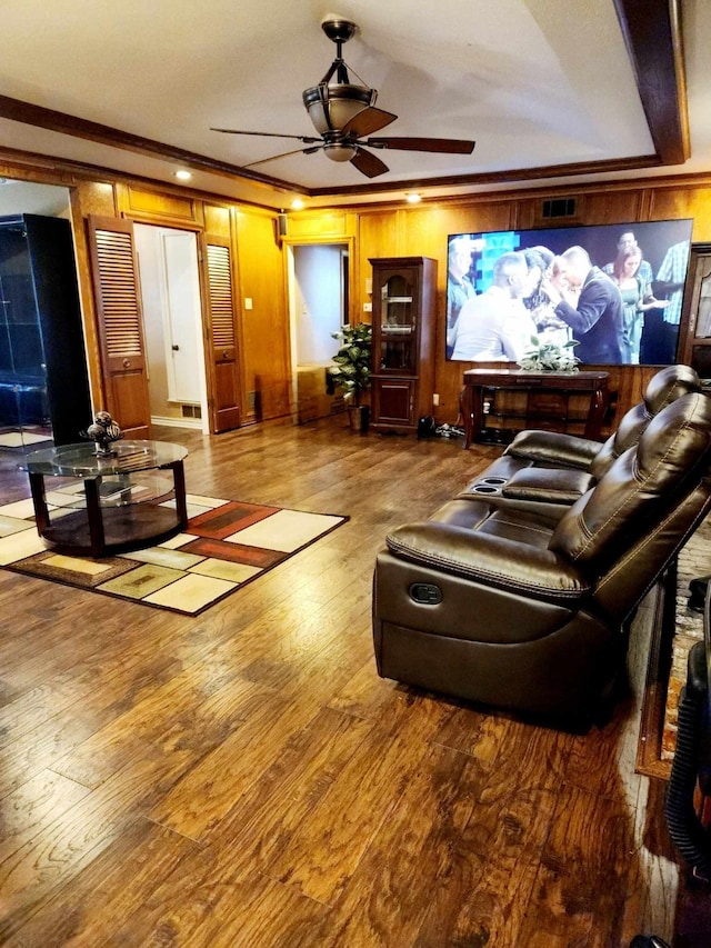 living room featuring hardwood / wood-style flooring and ornamental molding