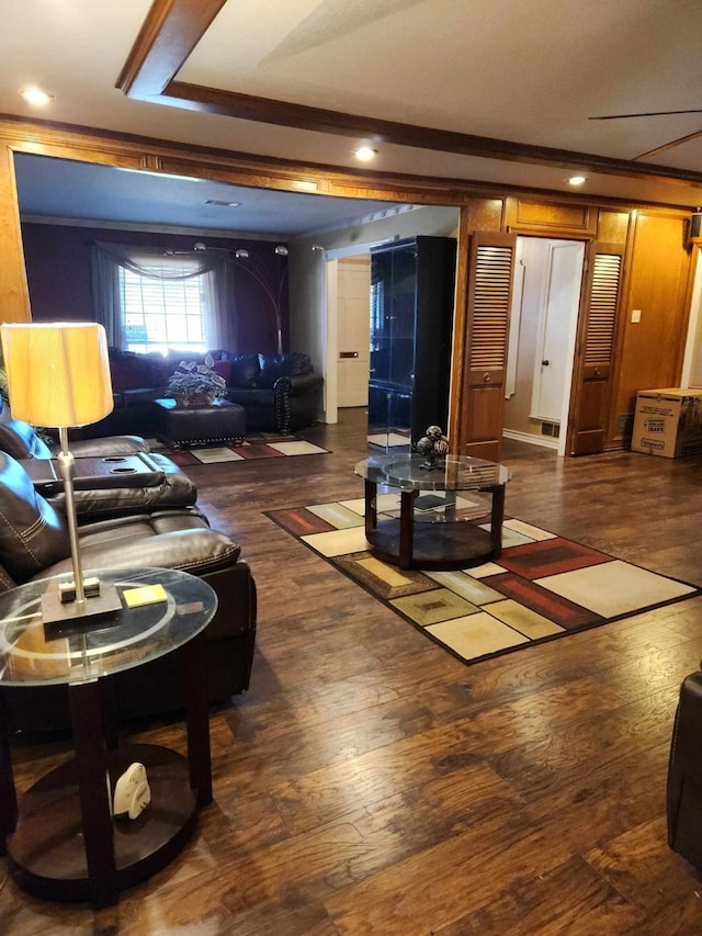 living room featuring crown molding and dark hardwood / wood-style floors