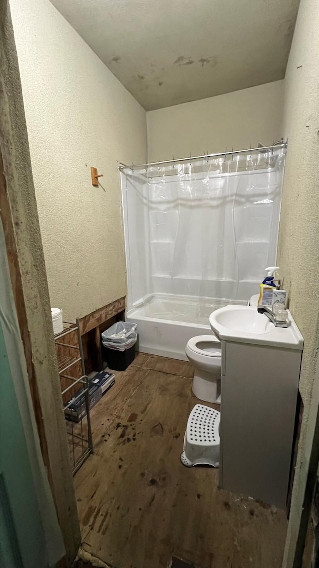 full bathroom with vanity, hardwood / wood-style floors, shower / bath combination with curtain, and toilet