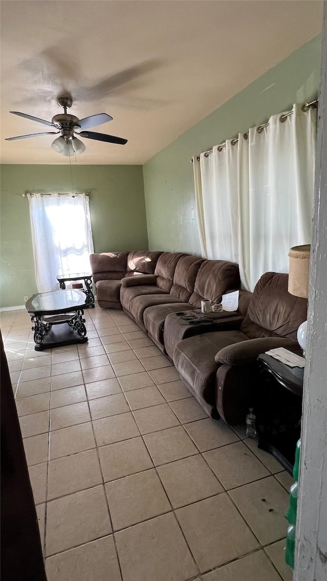 living room with light tile patterned flooring and ceiling fan