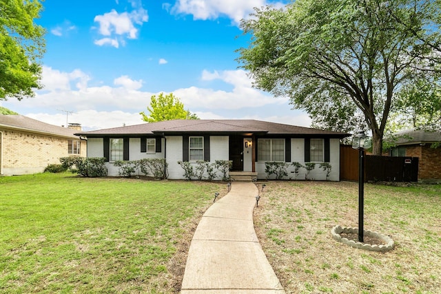 ranch-style home with a front lawn