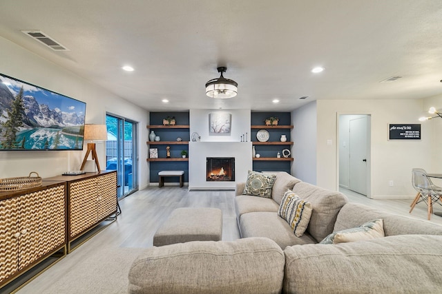 living room with light hardwood / wood-style floors