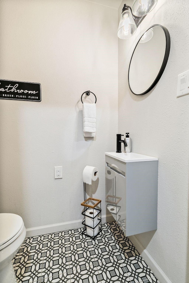 bathroom with vanity and toilet