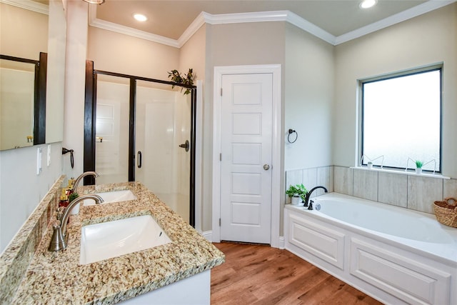 bathroom featuring vanity, hardwood / wood-style floors, crown molding, and separate shower and tub