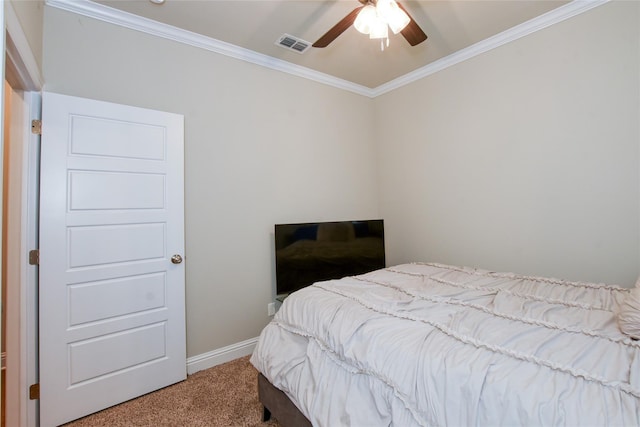 carpeted bedroom with crown molding and ceiling fan