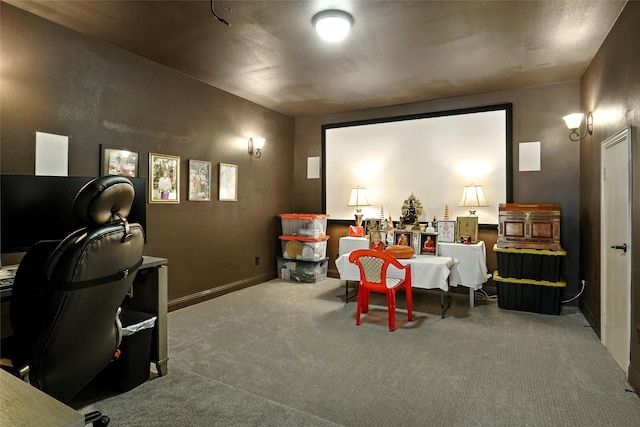 cinema room featuring carpet flooring