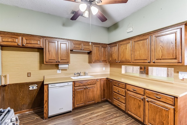 kitchen with sink, dark hardwood / wood-style flooring, white appliances, ceiling fan, and a textured ceiling