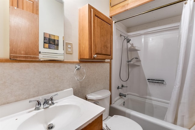 full bathroom featuring shower / bath combo, vanity, and toilet