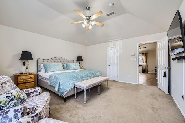 carpeted bedroom with ceiling fan and lofted ceiling