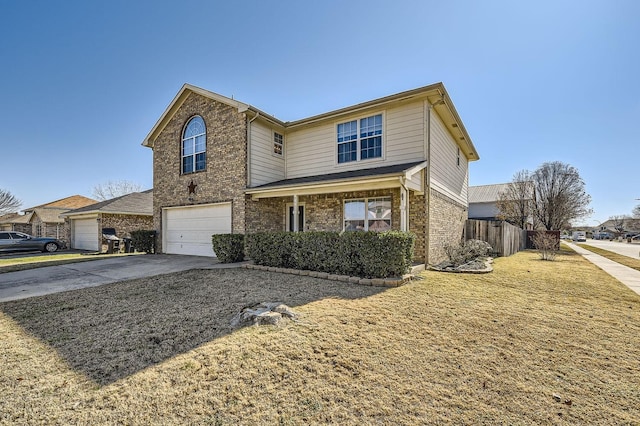 view of property with a garage and a front lawn