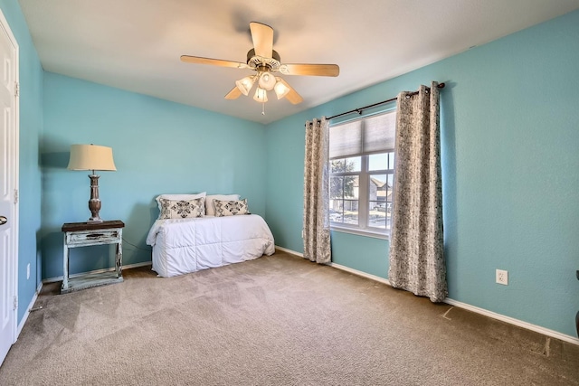 unfurnished bedroom with ceiling fan and carpet flooring