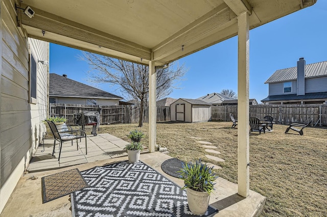 view of patio / terrace with a shed