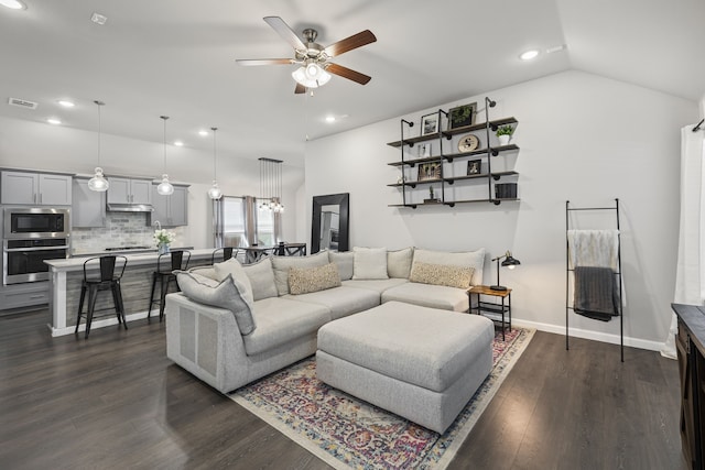 living room featuring lofted ceiling, dark hardwood / wood-style floors, and ceiling fan