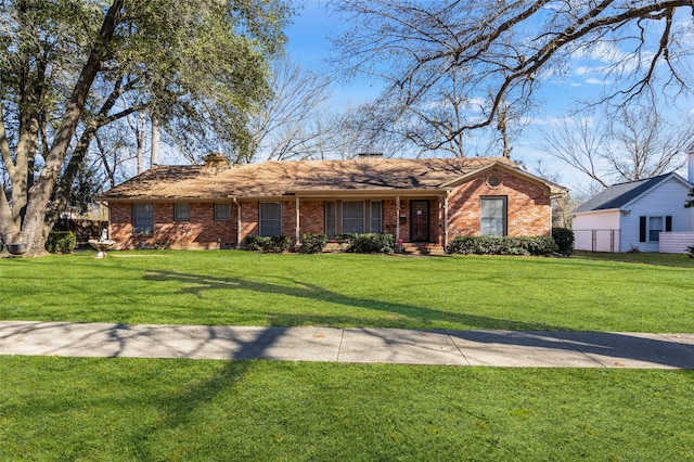 ranch-style home with a front yard