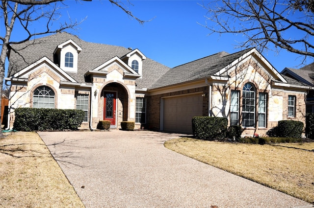 view of front of property with a garage