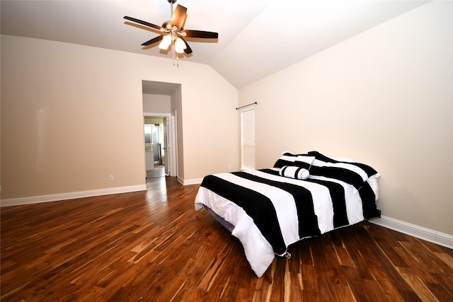 bedroom with vaulted ceiling, dark hardwood / wood-style floors, and ceiling fan