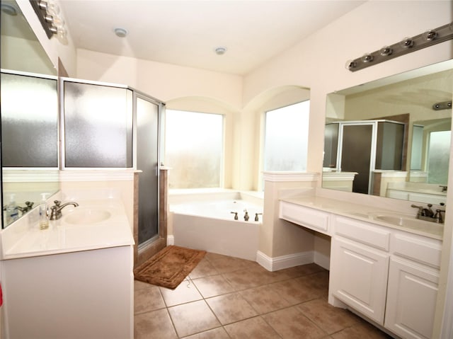 bathroom featuring shower with separate bathtub, tile patterned floors, and vanity