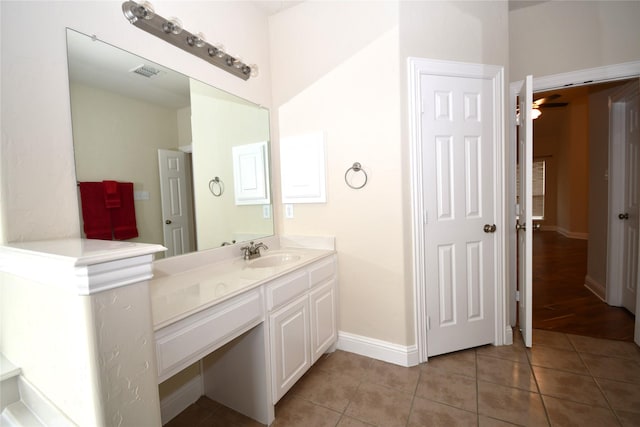 bathroom featuring tile patterned flooring and vanity