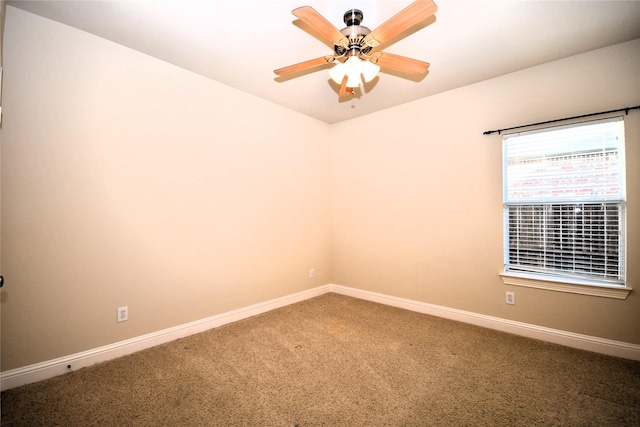 carpeted empty room with ceiling fan