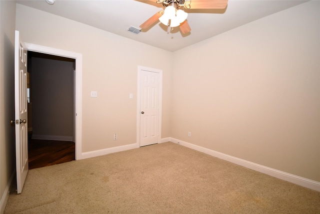 unfurnished bedroom with ceiling fan and carpet