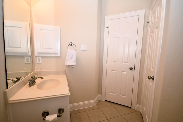 bathroom with vanity and tile patterned flooring