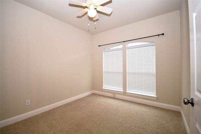 empty room featuring carpet floors and ceiling fan