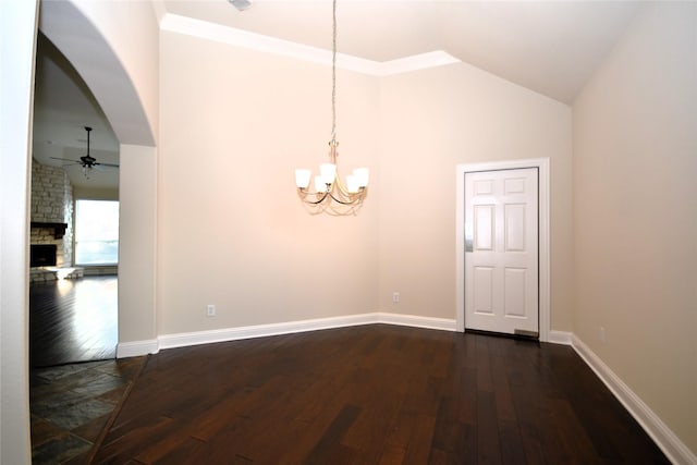 interior space featuring dark wood-type flooring, high vaulted ceiling, a fireplace, and ceiling fan with notable chandelier