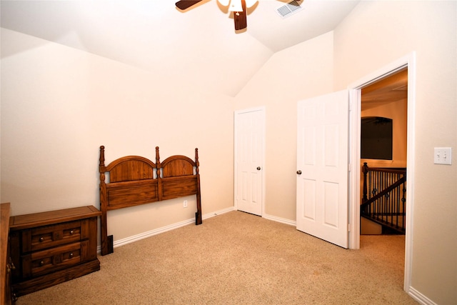 carpeted bedroom featuring ceiling fan and lofted ceiling